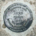 A round metal reference mark of MT TOM