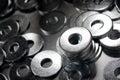 Round metal steel washers on a table Royalty Free Stock Photo