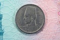 round metal ten Egyptian milliemes series 1941 AD 1360 AH features bust of King Farouk I of Egypt on obverse side and value and