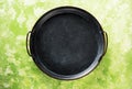 Round metal Tray on green concrete backdrop Surface copy space Royalty Free Stock Photo