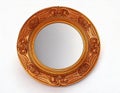 Decorative round mirror with ornate golden frame displayed against a white background Royalty Free Stock Photo