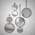 Round mirrors hanging on the wall reflecting interior design scene, minimalist white bedroom, modern Royalty Free Stock Photo