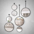 Round mirrors hanging on the wall reflecting interior design scene, minimalist white living, modern