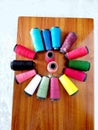 Round Multi Colored Sewing Nylon Thread on Table