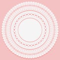 Round napkin on a pink background. Openwork lace pattern.