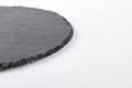 Round natural slate cheese board. Royalty Free Stock Photo