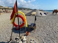 Round non-sinking red life buoy for safety to save the lives of drowning people tourists on the beach in a warm eastern tropical Royalty Free Stock Photo