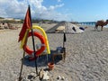 Round non-sinking red life buoy for safety to save the lives of drowning people tourists on the beach in a warm eastern tropical Royalty Free Stock Photo