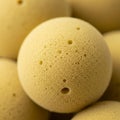 Round objects resembling sponge balls with a porous surface texture Royalty Free Stock Photo