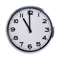 Round office clock shows eleven o'clock Royalty Free Stock Photo