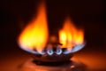 Round orange blue burning gas flame black background close up Royalty Free Stock Photo