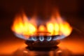 Round orange blue burning gas flame black background close up Royalty Free Stock Photo