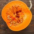 Round orange pumpkin half in cut