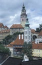 The round painted tower of the town Castle and the church of St. Jost, Cesky Krumlov, Czech Republic. Cesky Krumlov is one of the