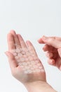 Round patches for acne and wrinkles on the hands on a white background. Acne and wrinkle patches for facial rejuvenation