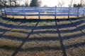 Open air round pen ready for a winter dressage training against morning sun Royalty Free Stock Photo