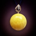 Round pendant of white royal amber from the Baltic Sea on a black background