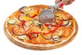 Round pizza cutter in a female hand