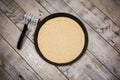 Round pizza dough is in the pan. Royalty Free Stock Photo