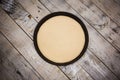 Round pizza dough is in the pan. Royalty Free Stock Photo