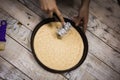 Round pizza dough is in the pan. Royalty Free Stock Photo