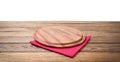 Round pizza food cutting board and table cloth red napkin on brown wooden table isolated on white background. Wood tray plate Royalty Free Stock Photo