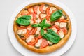 Round pizza on a white plate Royalty Free Stock Photo