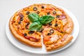 Round pizza on a white plate Royalty Free Stock Photo