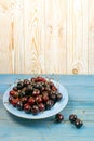 Fresh Overripe ripe Cherries on Blue Rustic Wooden Background Royalty Free Stock Photo