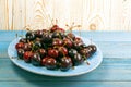 Fresh Overripe ripe Cherries on Blue Rustic Wooden Background Royalty Free Stock Photo