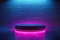A round platform in front of a brick wall with a blue and pink light Royalty Free Stock Photo