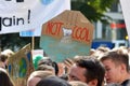 Round protest sign with polar bear on melting ice saying ` Not cool` held up by young people during Fridays for future strike for
