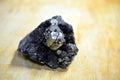 Round pyrit mineral in dark material Royalty Free Stock Photo