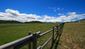 Round rail fence under blue sky in the Bighorn Mountain range in the Rocky Mountains near Sheridan Wyoming US Royalty Free Stock Photo