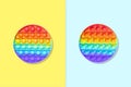 Round rainbow silicone kids toys antistress pop it or simple dimple from two sides on a blue and yellow background