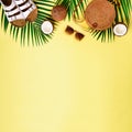 Round rattan bag, coconut, birkenstocks, palm branches, sunglasses on yellow background. Square crop. Top view, copy