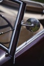 Round rear view mirror on a vintage car