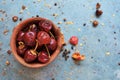 Round red chillies on the small clay pot. Royalty Free Stock Photo