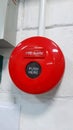 round red fire alarm installed on the wall in the room Royalty Free Stock Photo