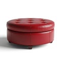 Round red tufted leather storage ottoman with dark legs Royalty Free Stock Photo