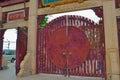 Round red wooden gateway outside Chinese temple Royalty Free Stock Photo
