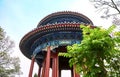 Round roof of Pavilion in Jingshan Park Beijing. Traditional Chinese-style pavilion on a hill against a blue sky.
