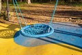 Round rope swing on the playground