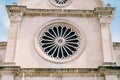 Round rose window close-up in the triple-nave basilica of St. James in Sibenik, Croatia