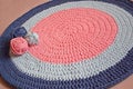 Round rug made of handmade knitted yarn. Royalty Free Stock Photo