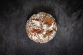 Round rustic bread on dark slate background in top-down studio setup Royalty Free Stock Photo
