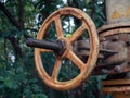 Round rusty valve on a pipe in the street Royalty Free Stock Photo