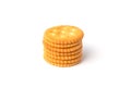 Round salted cracker cookies stacked isolated on white background