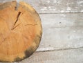 Round sawed pine tree licks on a wooden surface. The surface is old, it`s got paint peeled off. Royalty Free Stock Photo