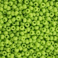 Round seed bead in opaque lime usable for background Royalty Free Stock Photo